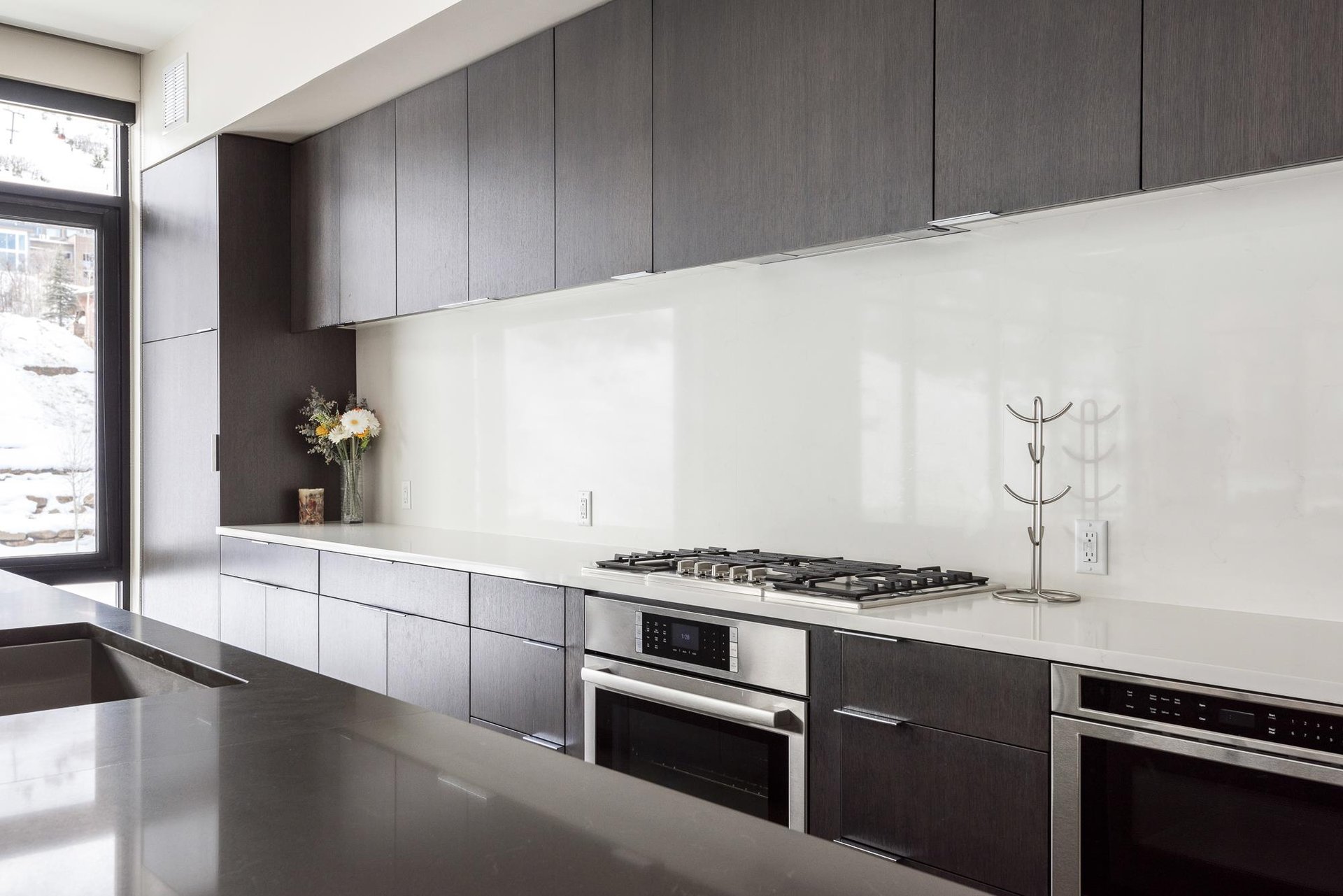 Fully equipped chefs kitchen with gas range, microwave drawer, kitchen island