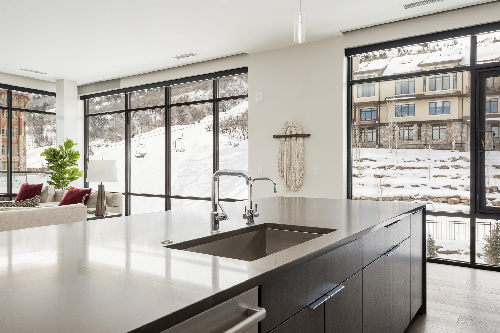 Perfectly situated kitchen island overlooking the pool deck and ski runs