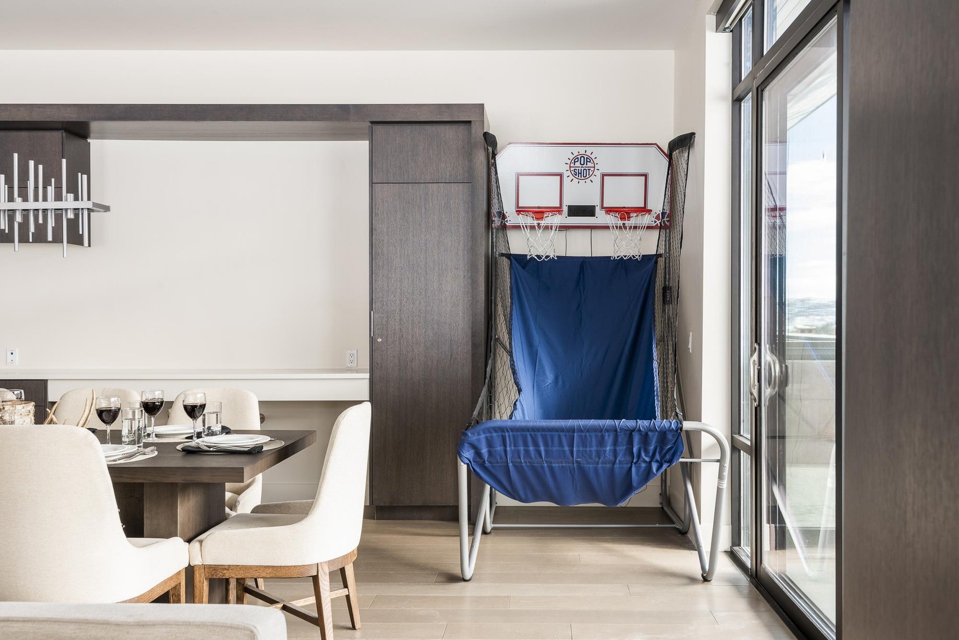 Kids and adults alike can work on their game with the PopAShot dual basketball hoop game in the dining room
