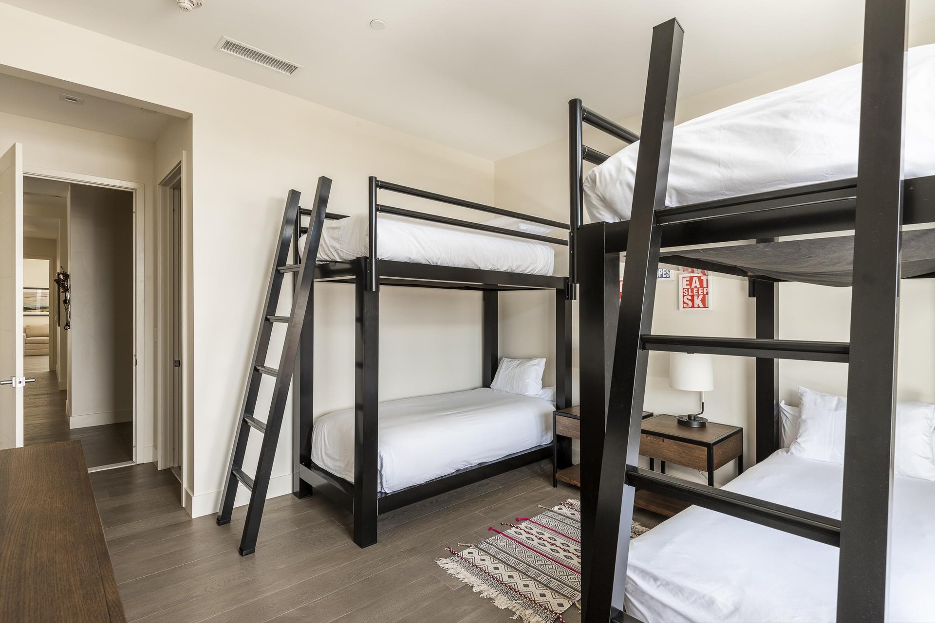 Sleep 4 in this guest bedroom with 2 bunk bed sets, large ladders for easy access to the top bunks