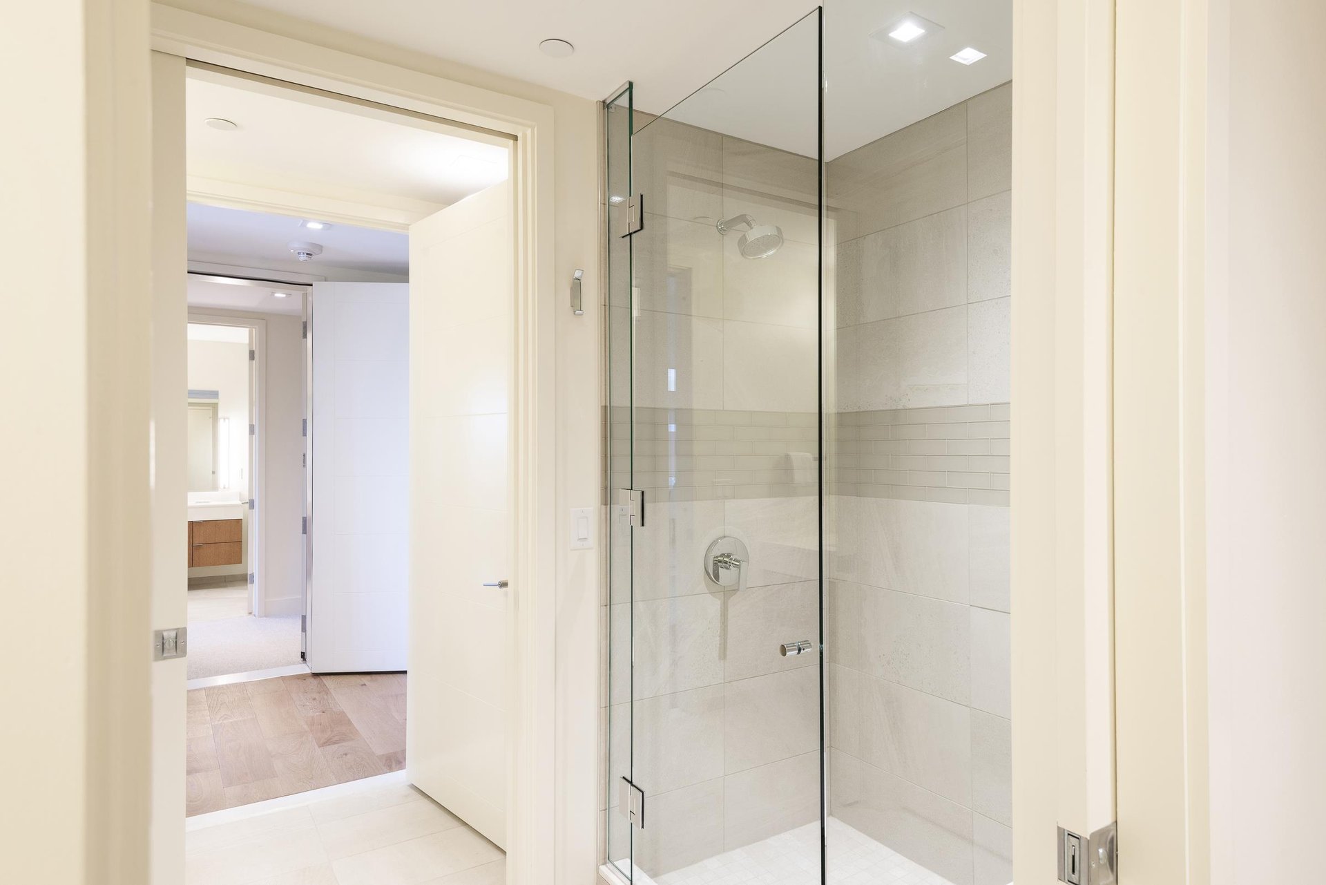 34 hallway bathroom tiled shower with glass door