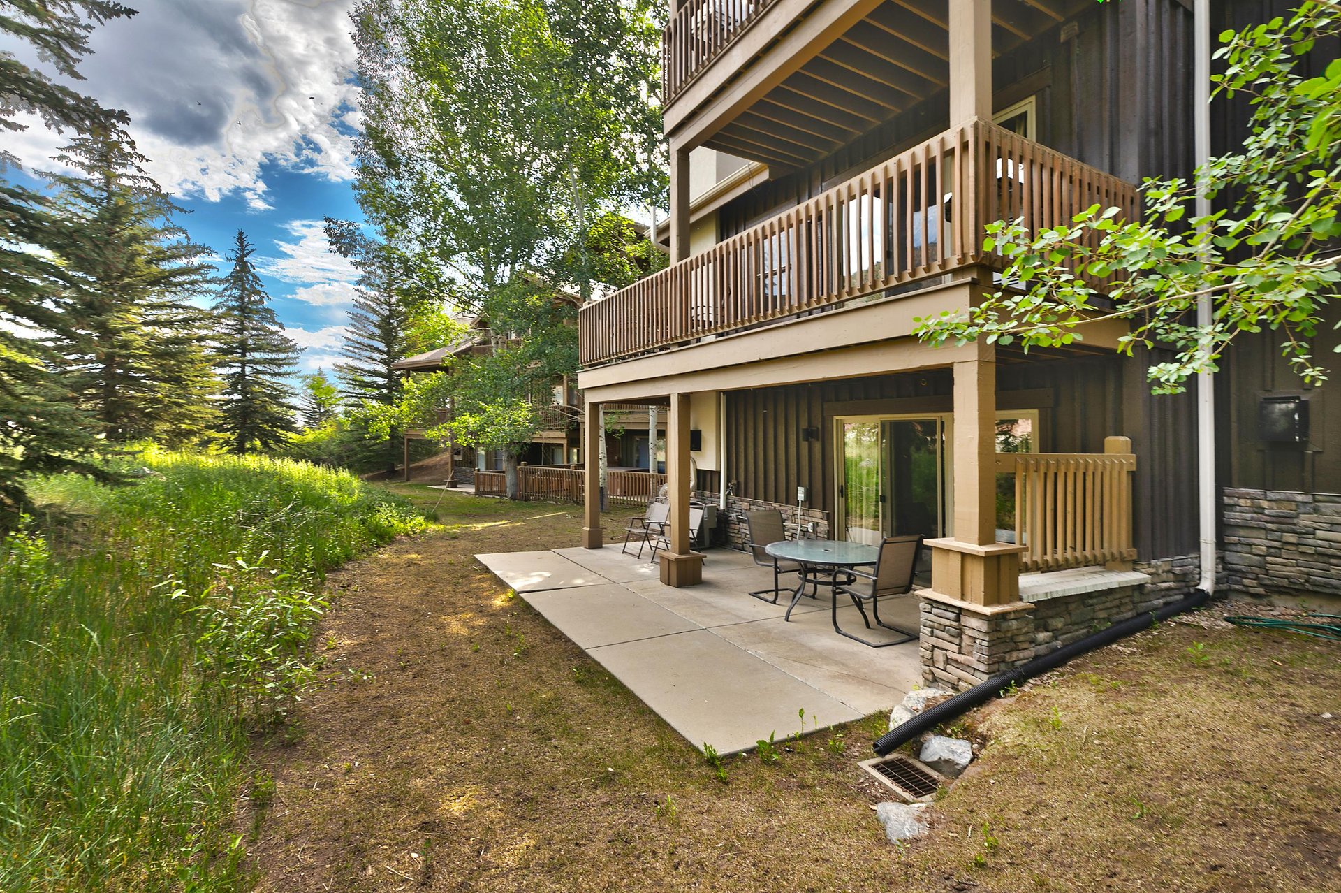 Lower level private patio on a sunny summer day