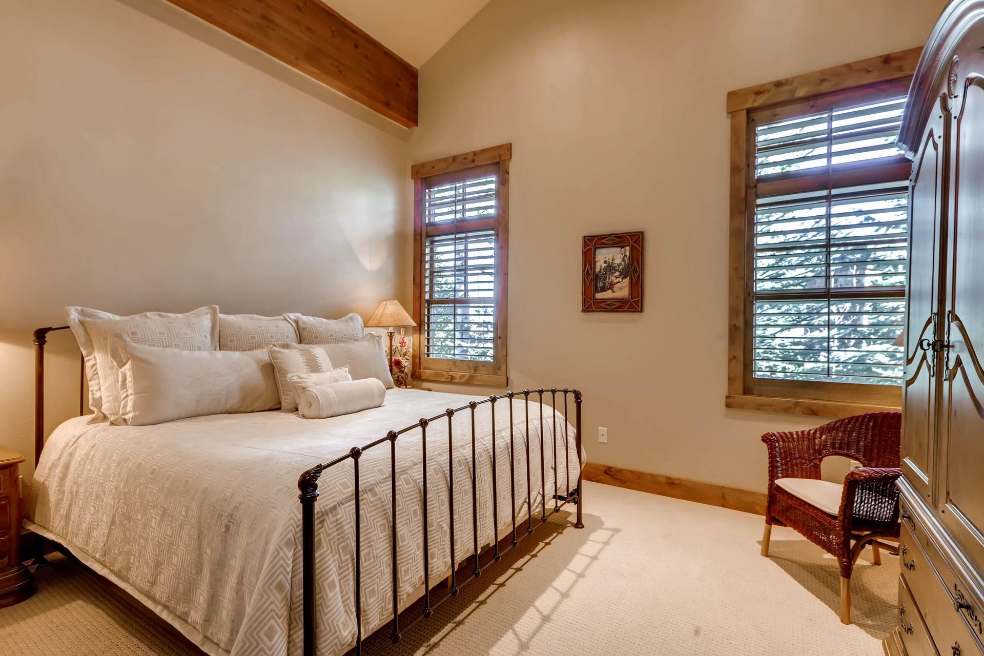 Superb comfort king bed in fourth guest bedroom, iron bedframe, large picture windows