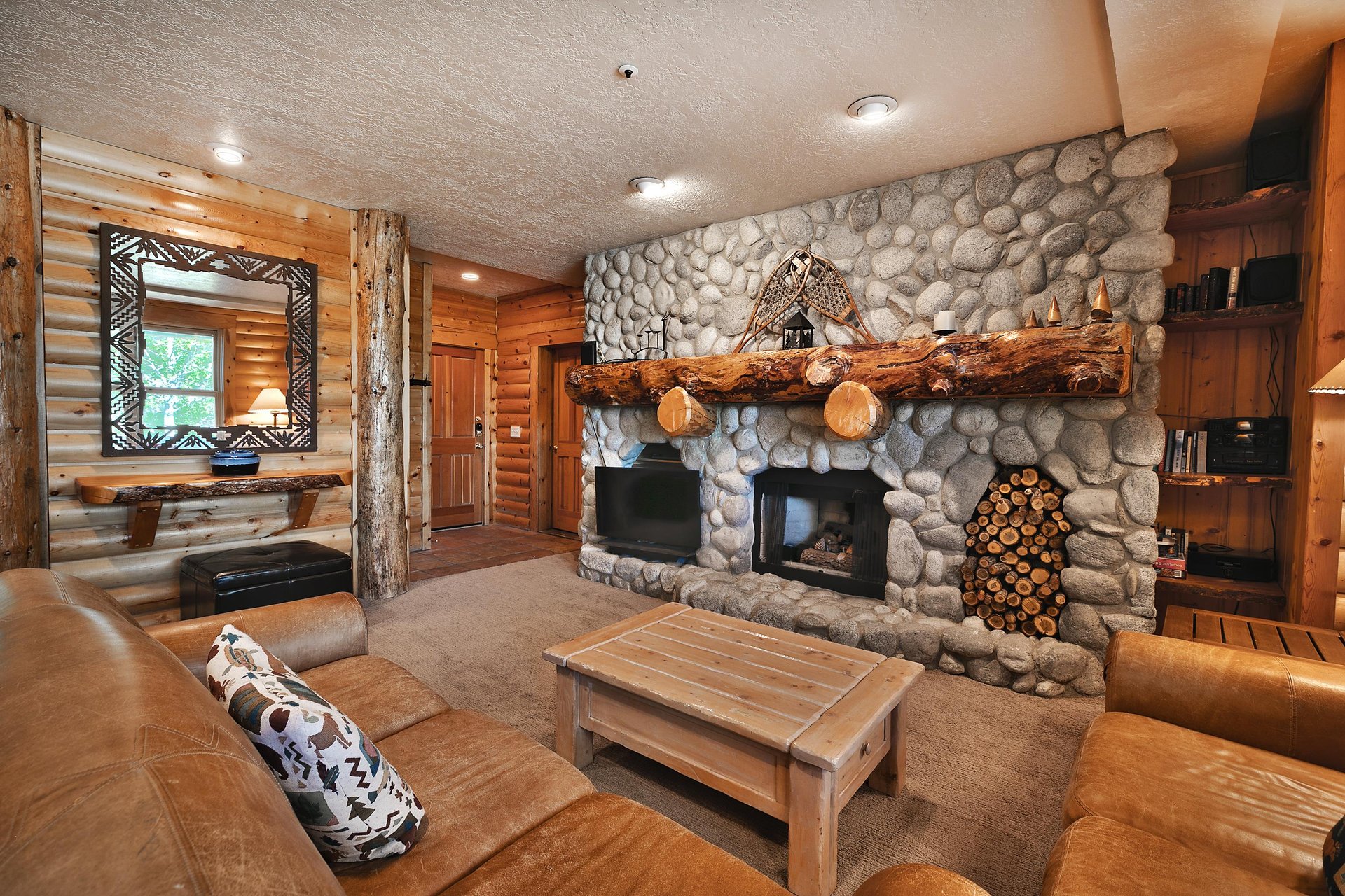 Gas burning fireplace in each living room, river rock wall and pine wood accents