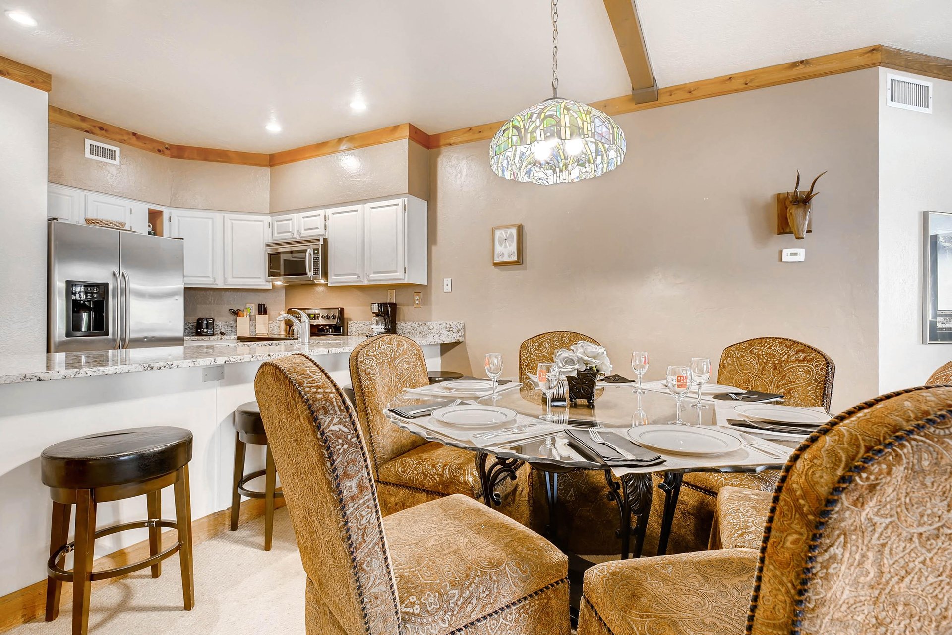 Inviting dining table seating 6  ParkCityLodging_PowderRunC11_Dining2