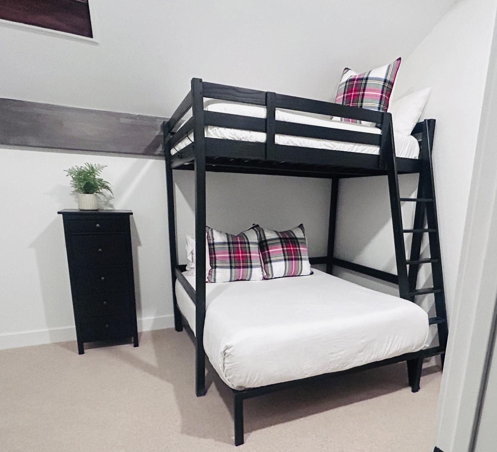 Snowcrest 317 vacation rental offers a queen over full bunk bed upstairs.