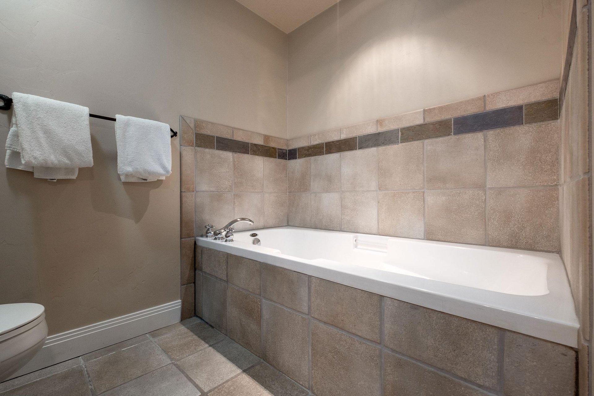 Soaking tub in the main bathroom