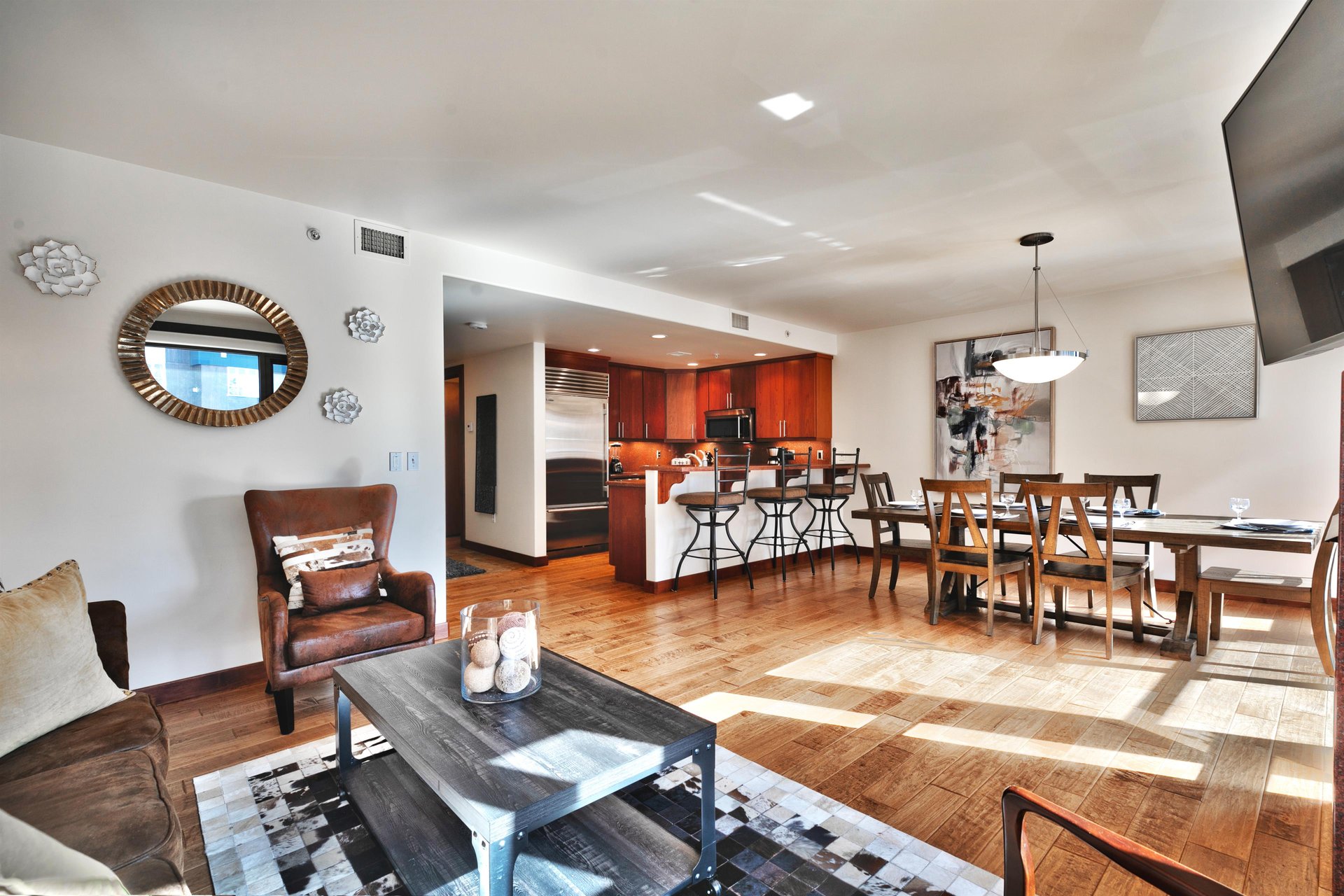 Beautiful natural light streaming in the living room and dining room
