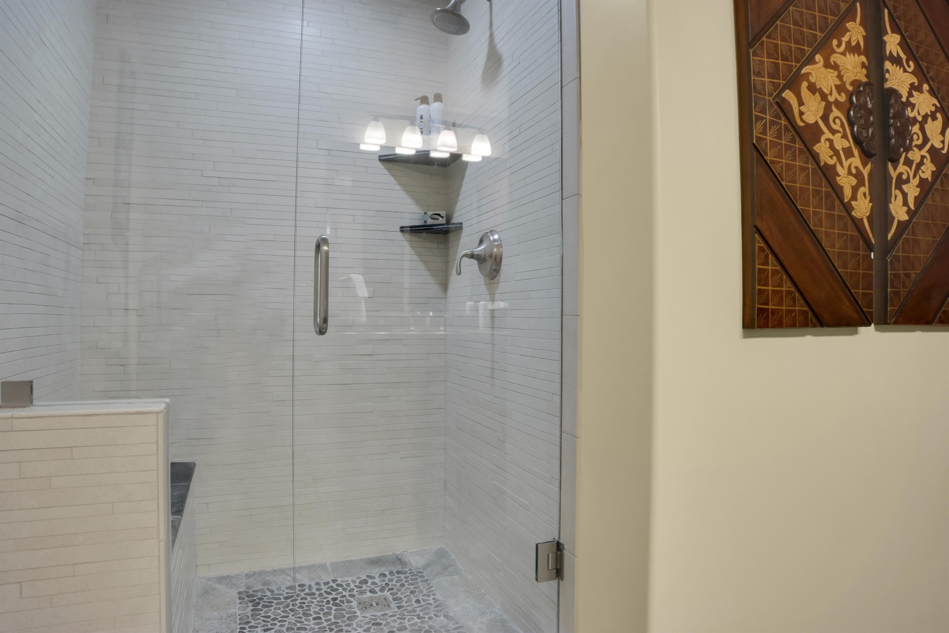 Lowell 304s walkin shower with greige color tile and built in bench.