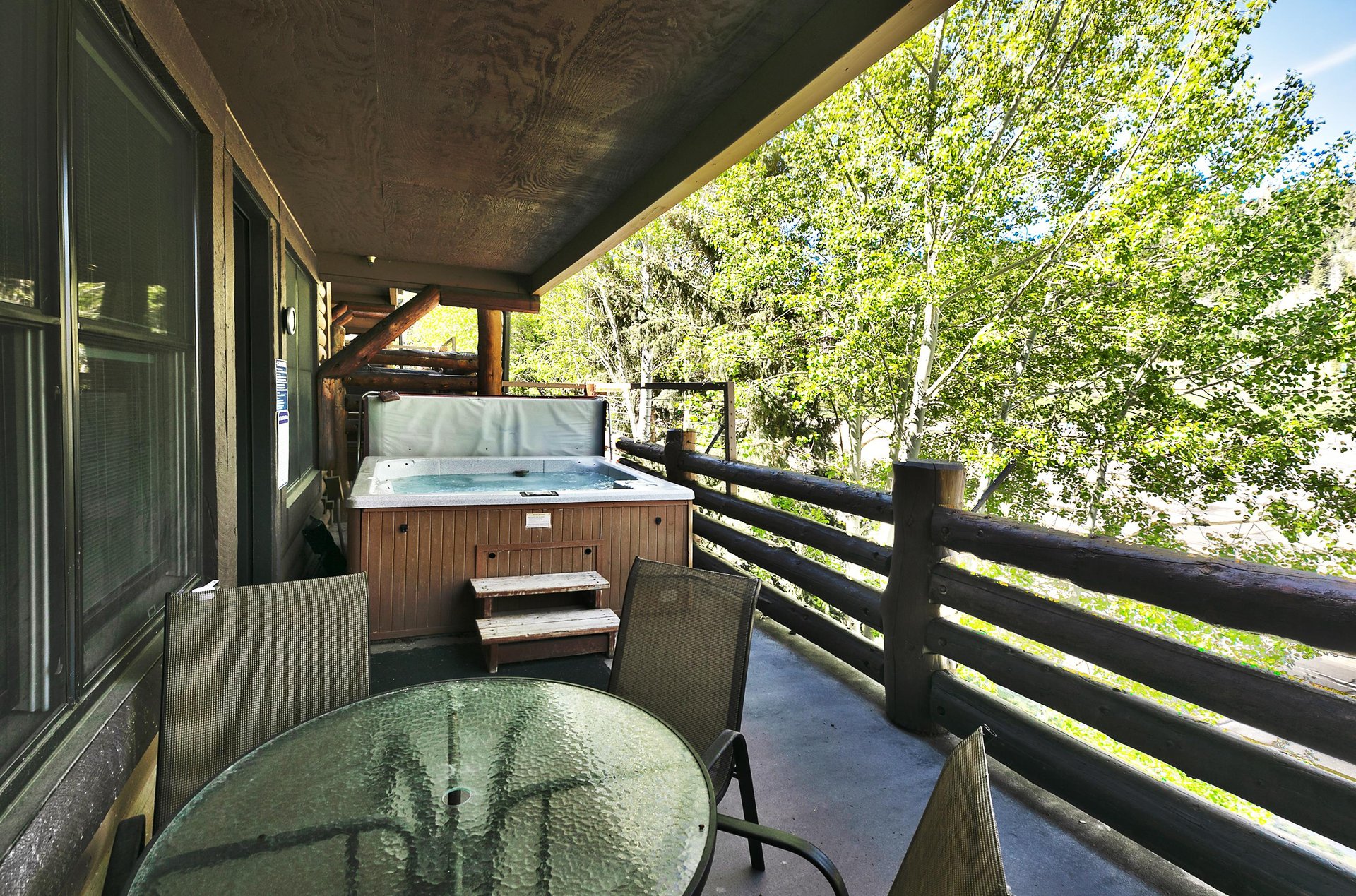 Relax on the private patio complete with your own hot tub and glass patio table and chairs