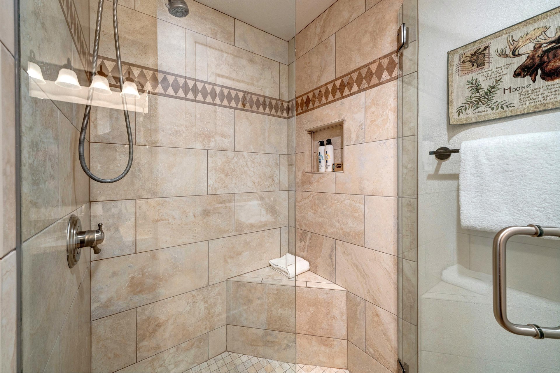 The second bedrooms shared bathroom has a walk in shower.