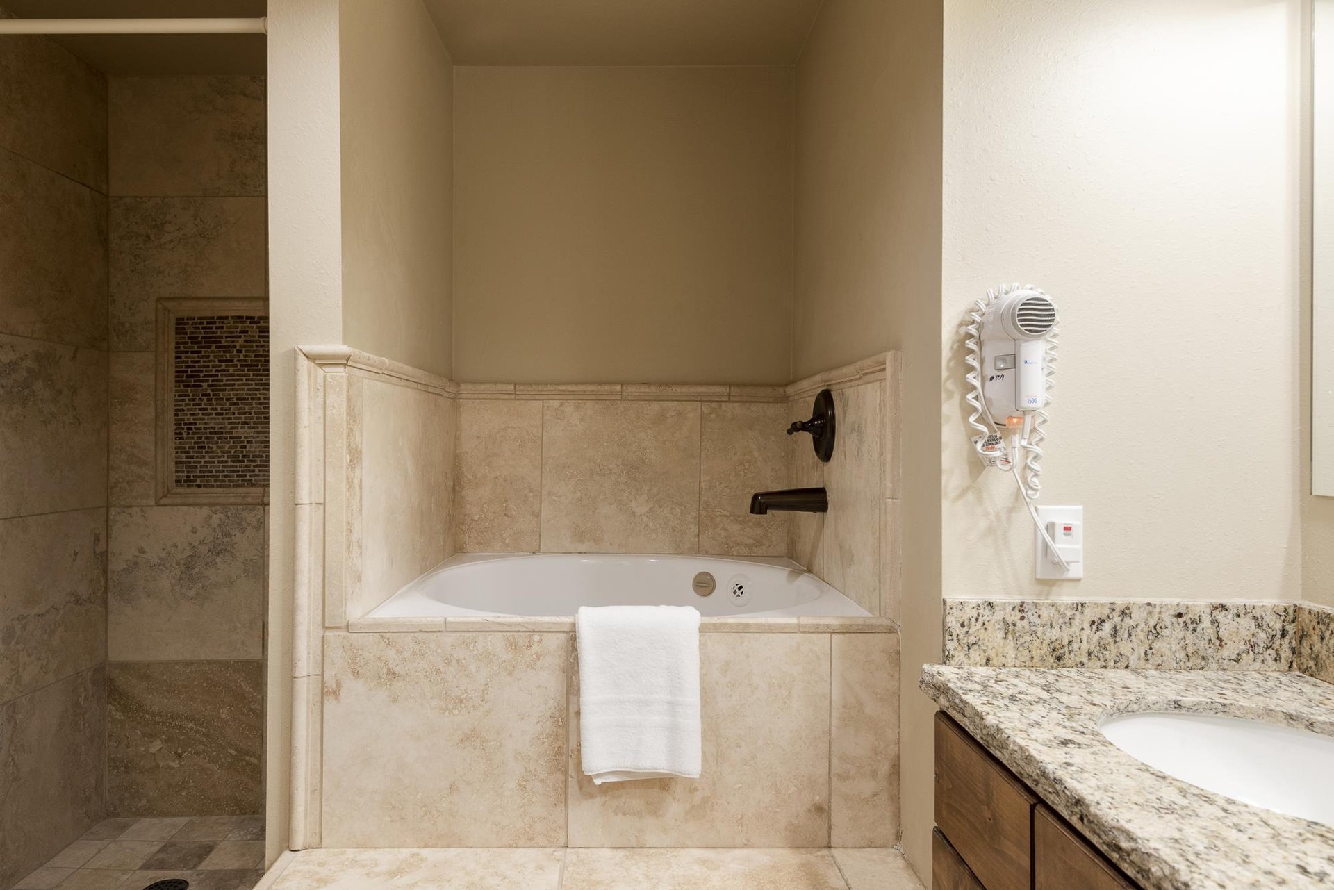 Guest bathroom with shower and jetted tub