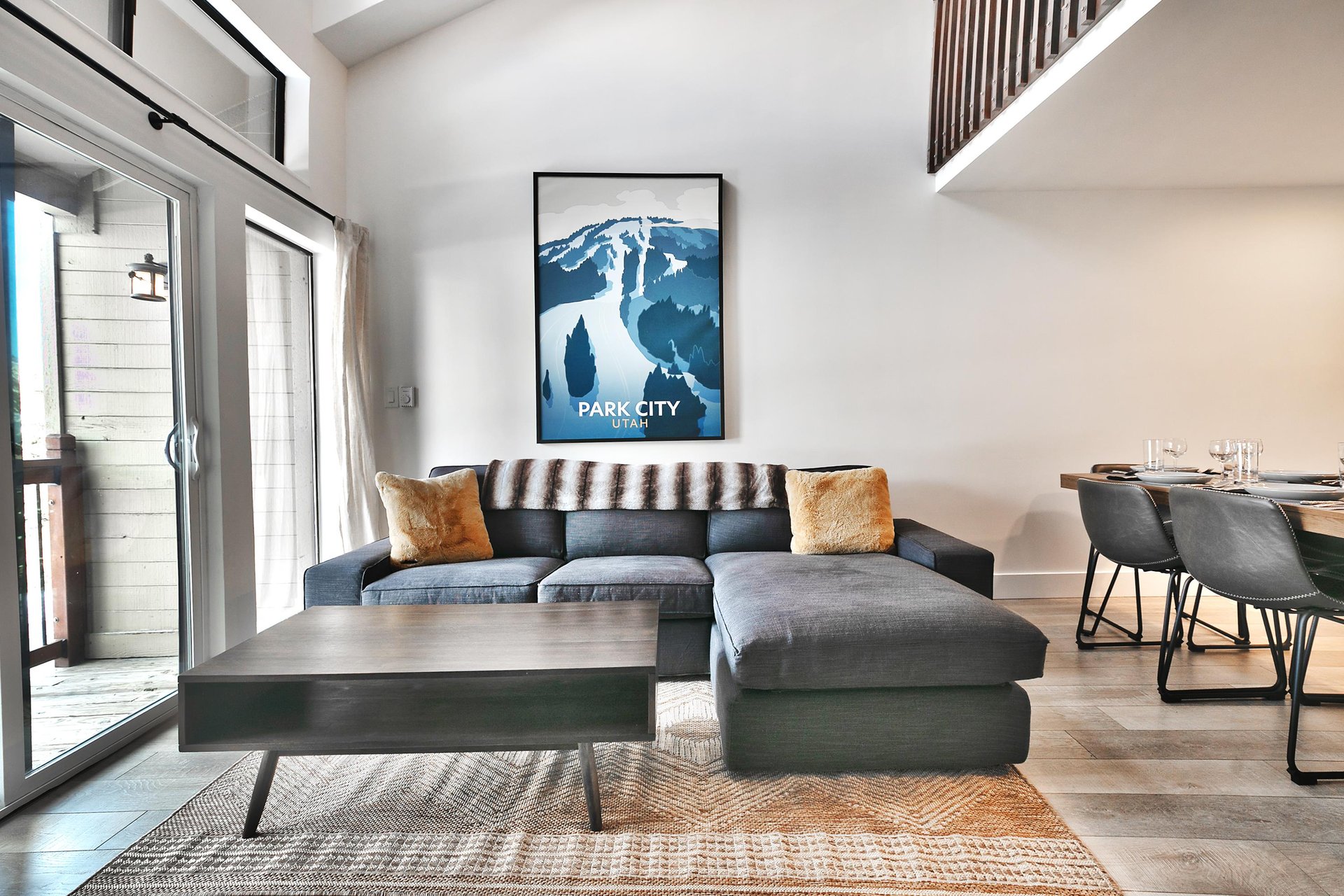 Sectional sofa in the living room accented with Park City mountain art