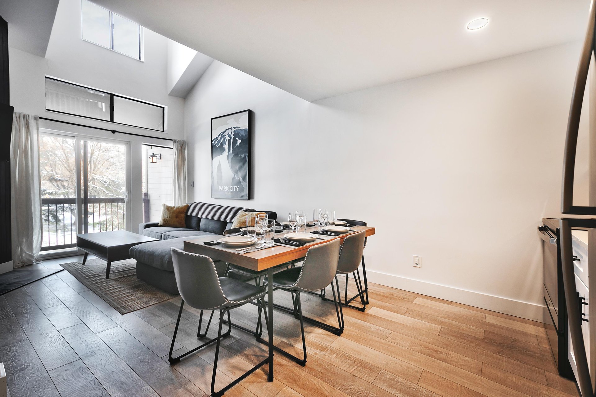Open floor plan with the kitchen, dining, and living area, hardwood floors throughout