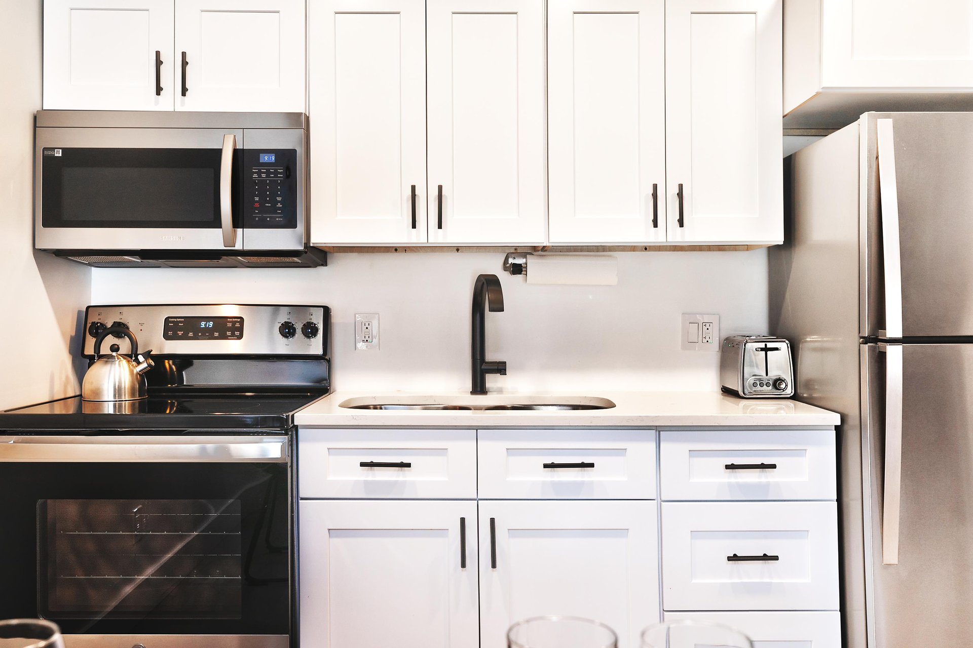 Kitchen with over the range microwave, electric range