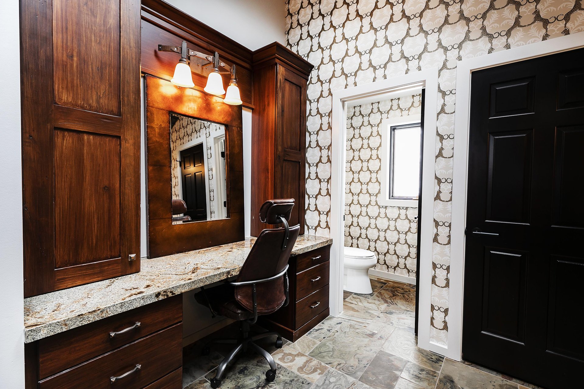 Ensuite private main bathroom with spacious vanity.