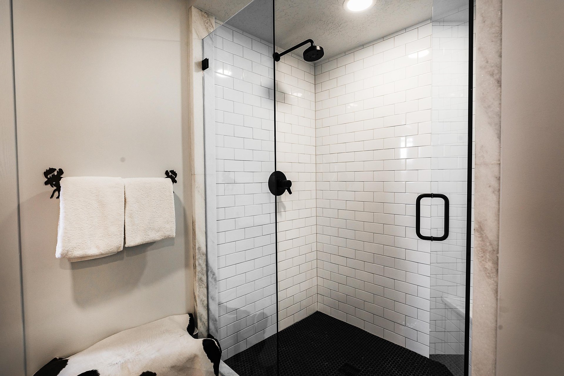 A bathroom with a walkin shower.