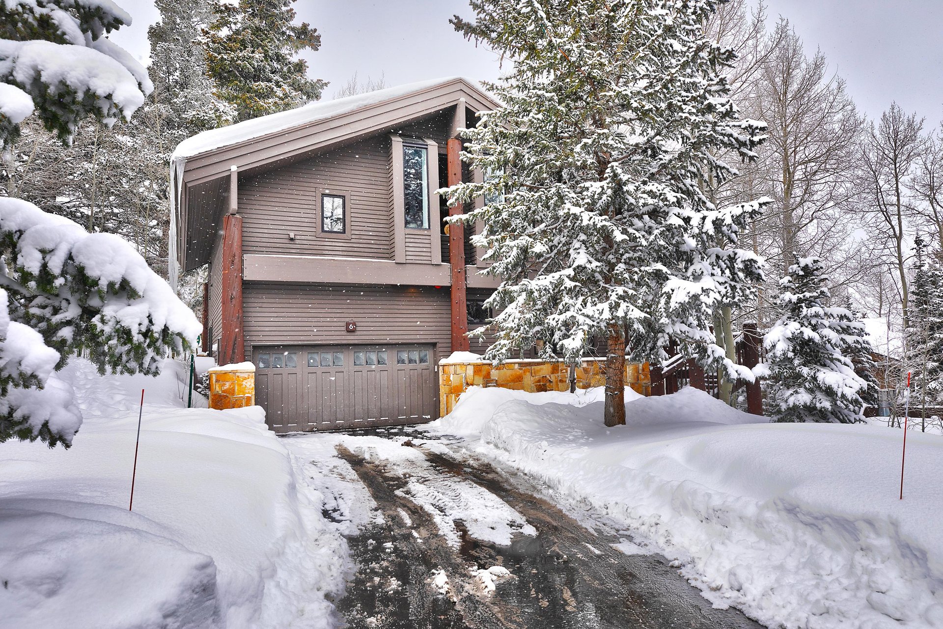 The exterior of Aspen Hollow 6 covered with snow.