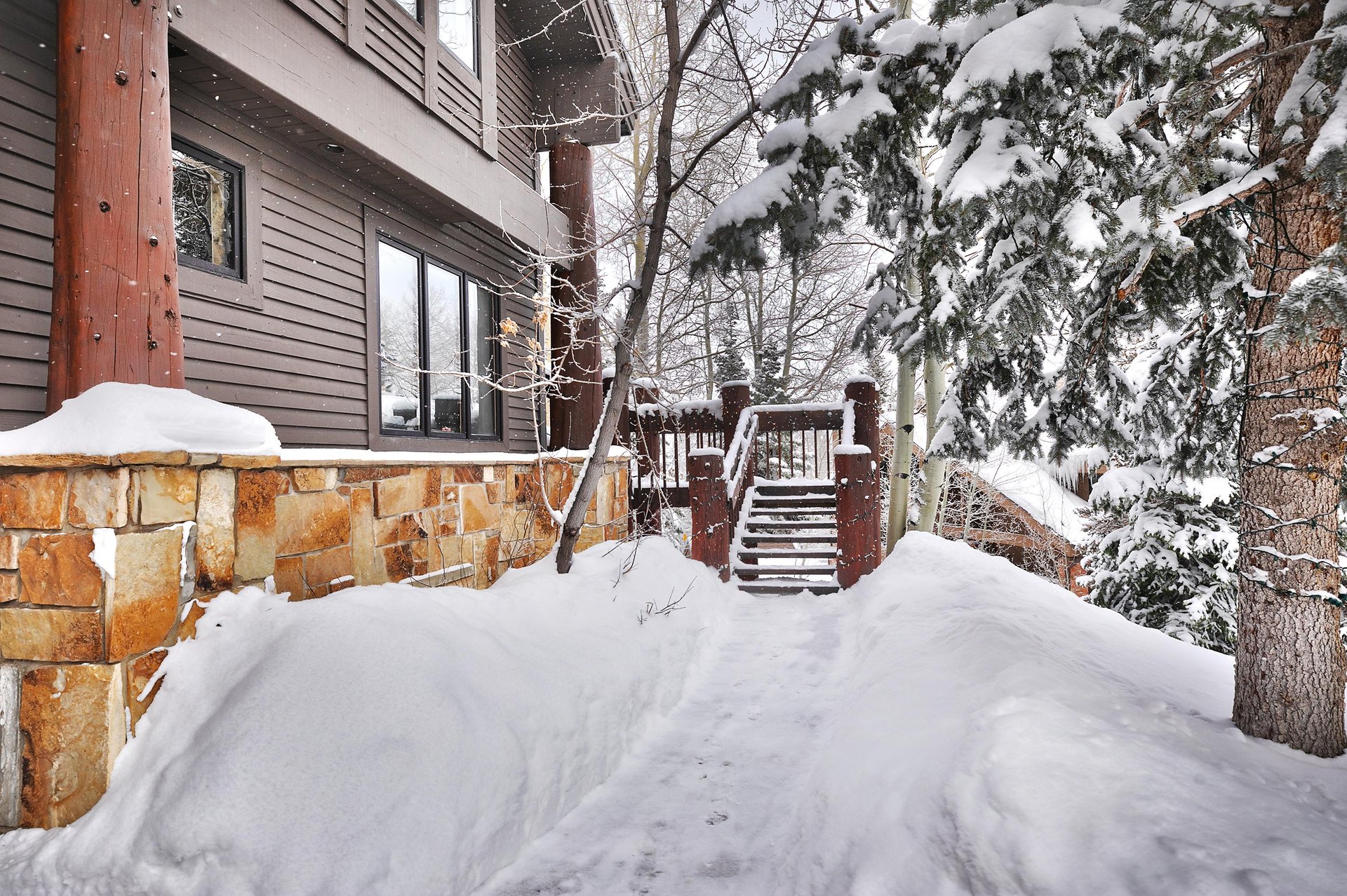 The exterior of Aspen Hollow 6 covered with snow.