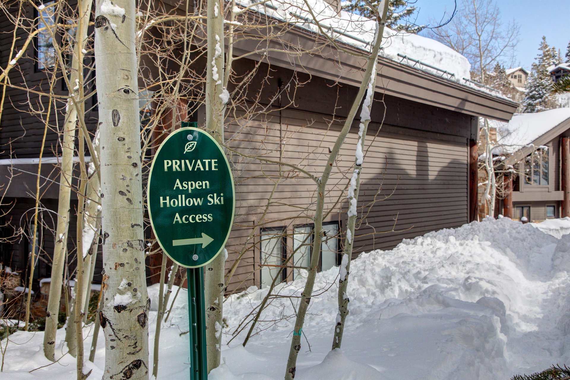 The exterior of Aspen Hollow 6 with a skiout trail to Deer Valley Resort.