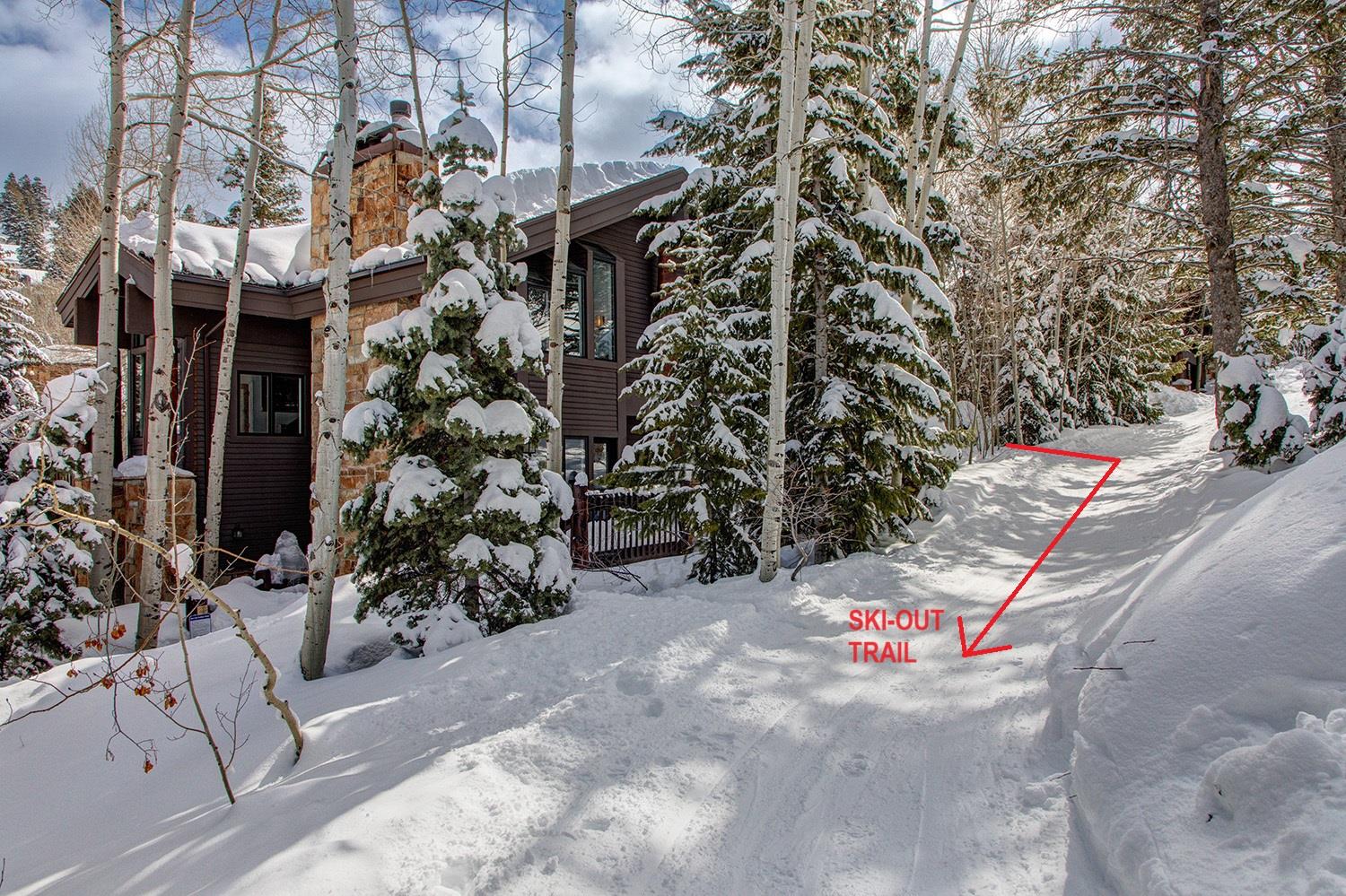 The exterior of Aspen Hollow 6 with a skiout trail to Deer Valley Resort.