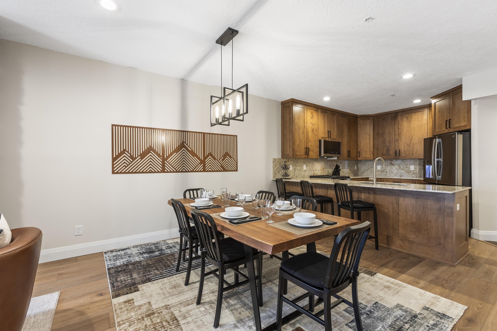 The open concept dining area with seating for 6 and the dining table.