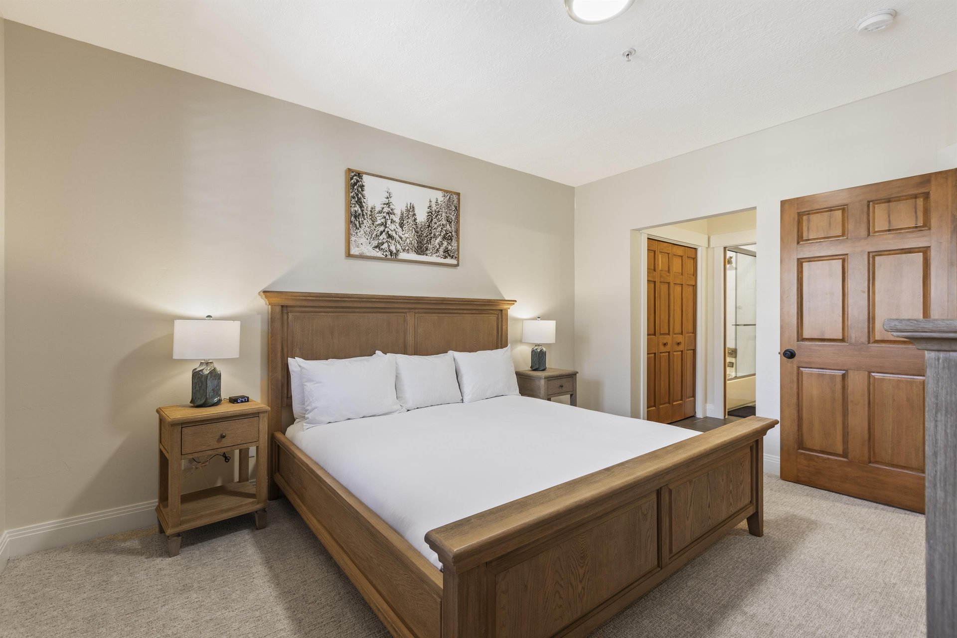 The main suite with a kingsize bed and en suite bathroom.