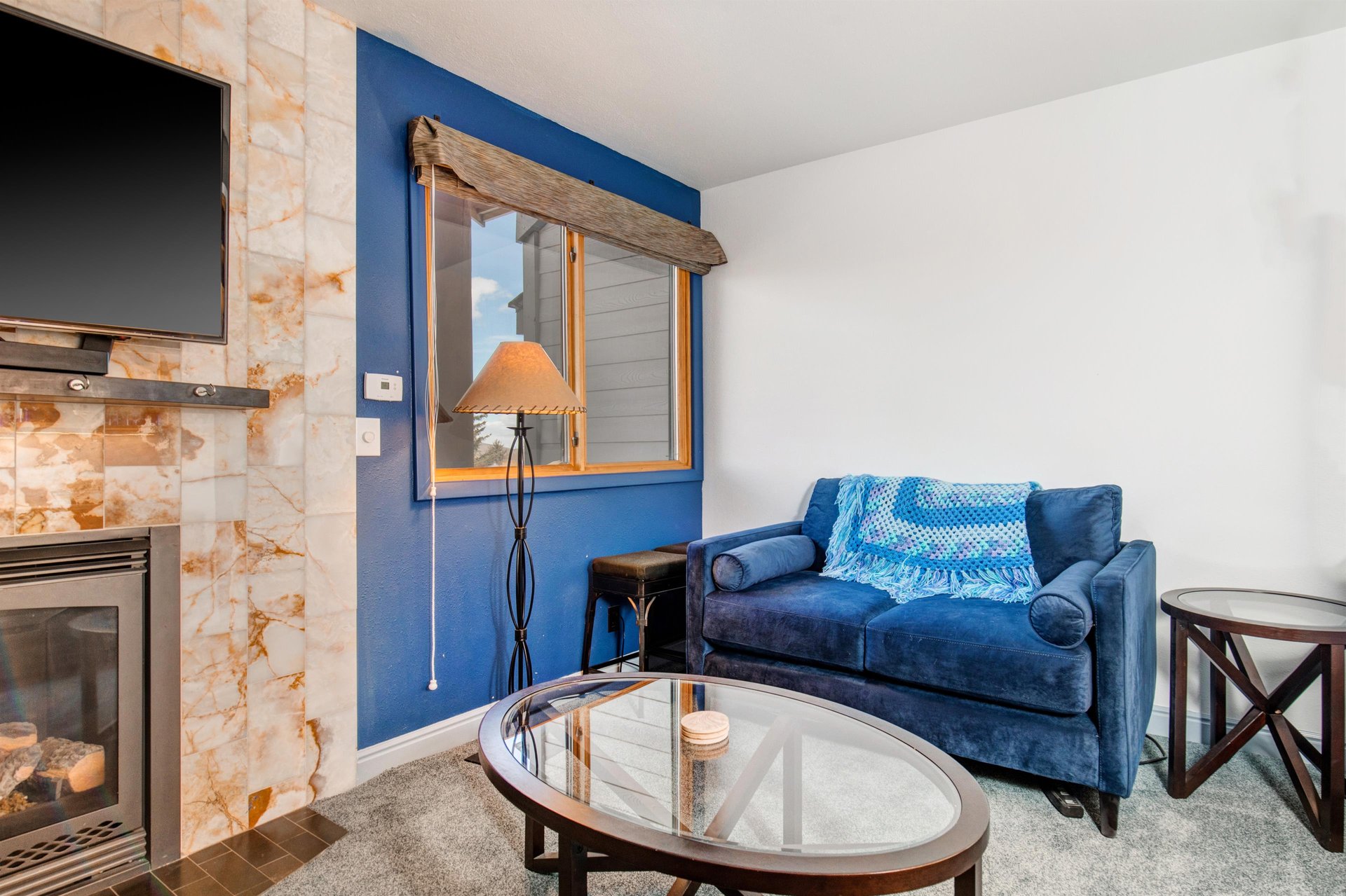 An additional blue sofa in the living area.