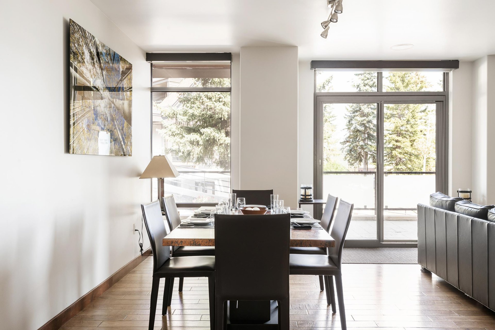 Dining area with large window walls for plenty of natural light