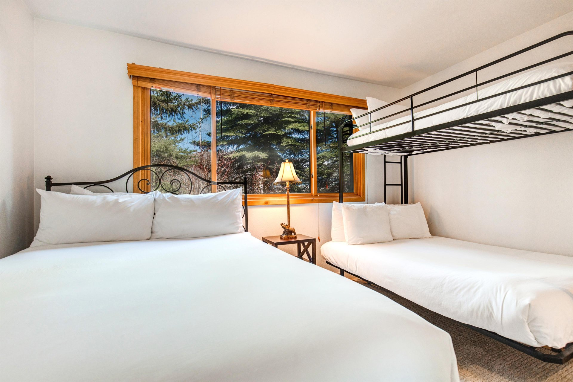 The second bedroom has a queen size bed and a bunk bed with a full on the bottom and a twin on the top.