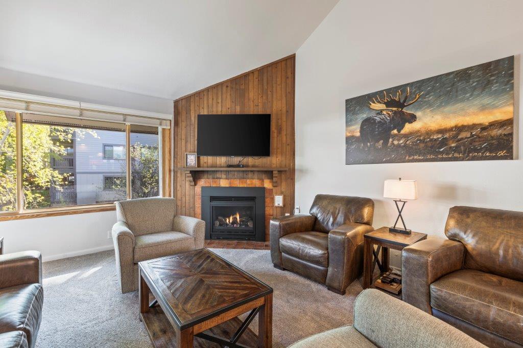 Snow Flower 79 has a living room with plentiful seating, flat screen TV and gas burning fireplace.