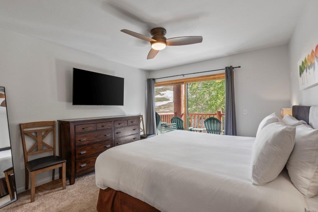 The main suite offers a kingsize bed and sliding glass doors that lead to a private patio.