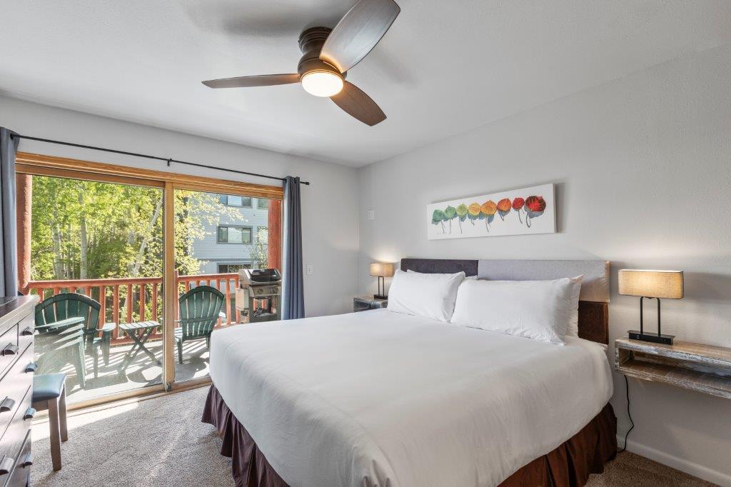The main suite offers a kingsize bed and sliding glass doors that lead to a private patio.