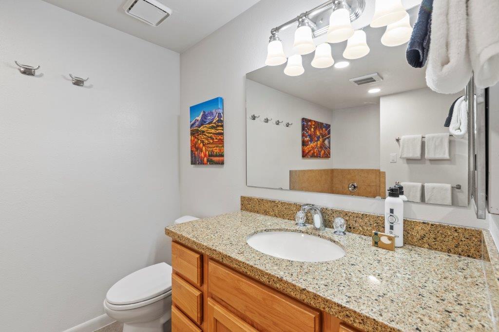 The en suite bathroom with a single sink vanity.
