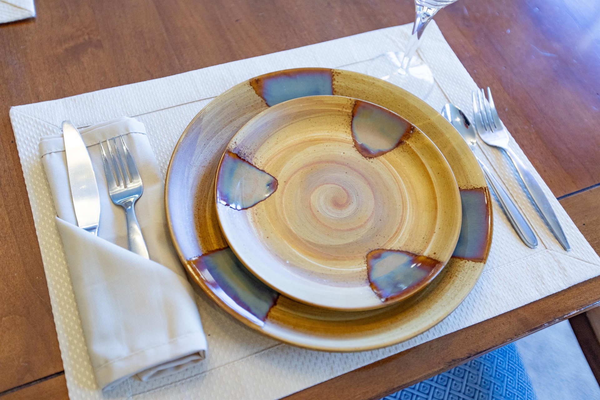 Unique dishes and a place setting at the dining table