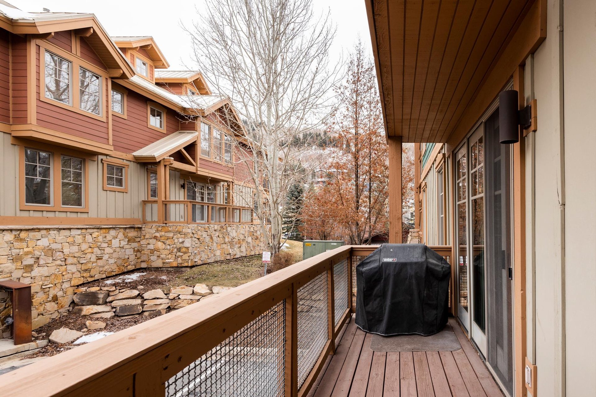 Second private balcony with BBQ in late fall.