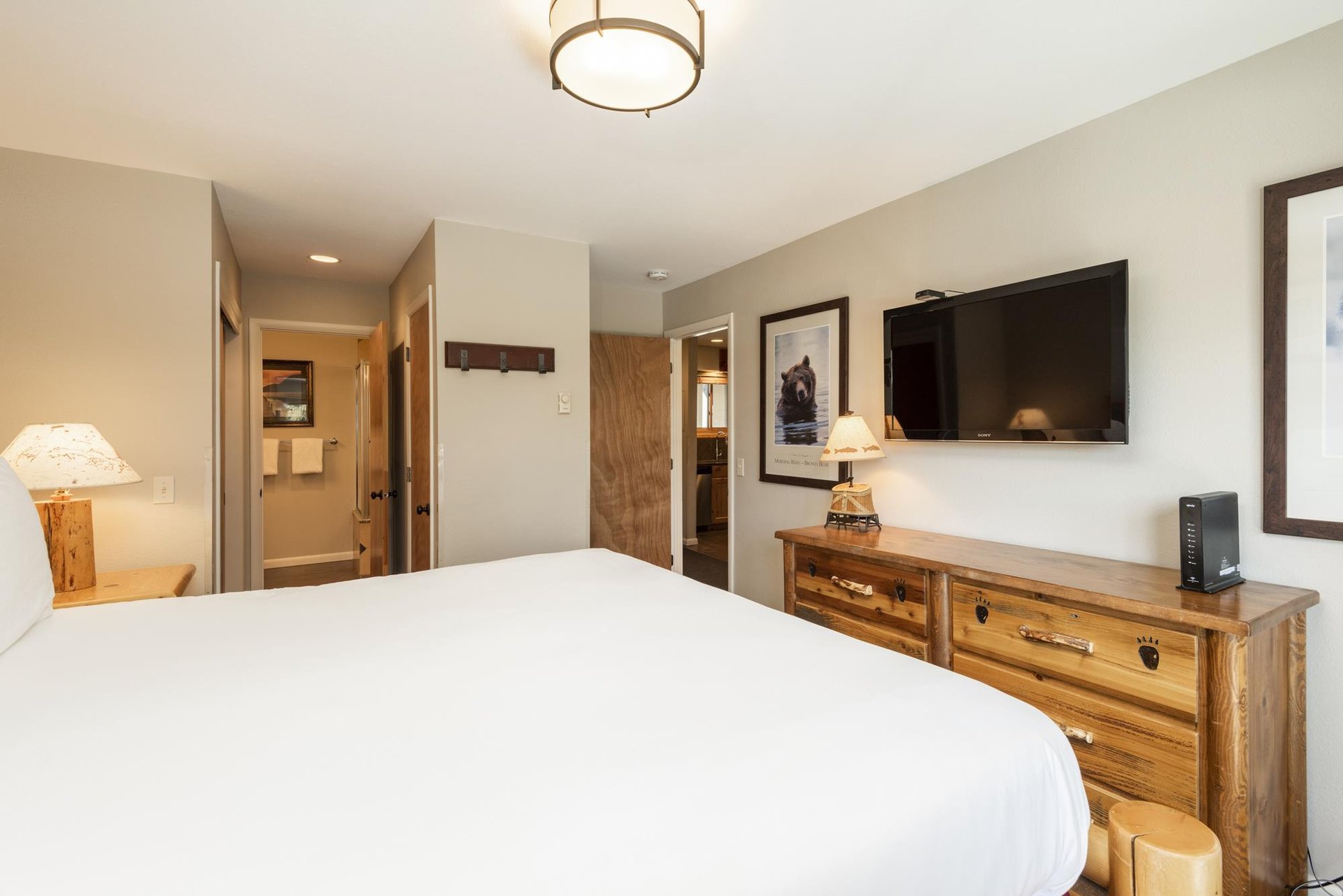 Wall mounted TV in the main bedroom