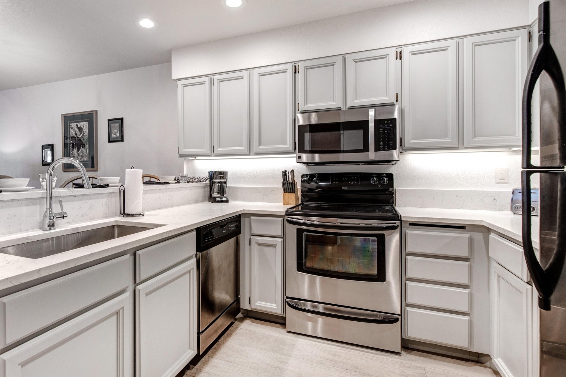 Snow Flower 152 has a well equipped kitchen with grey cabinets and stainless steel appliances.
