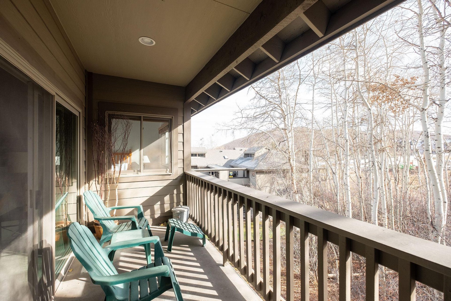 Relax on the deck chairs and take in the aspen grove and resort views.