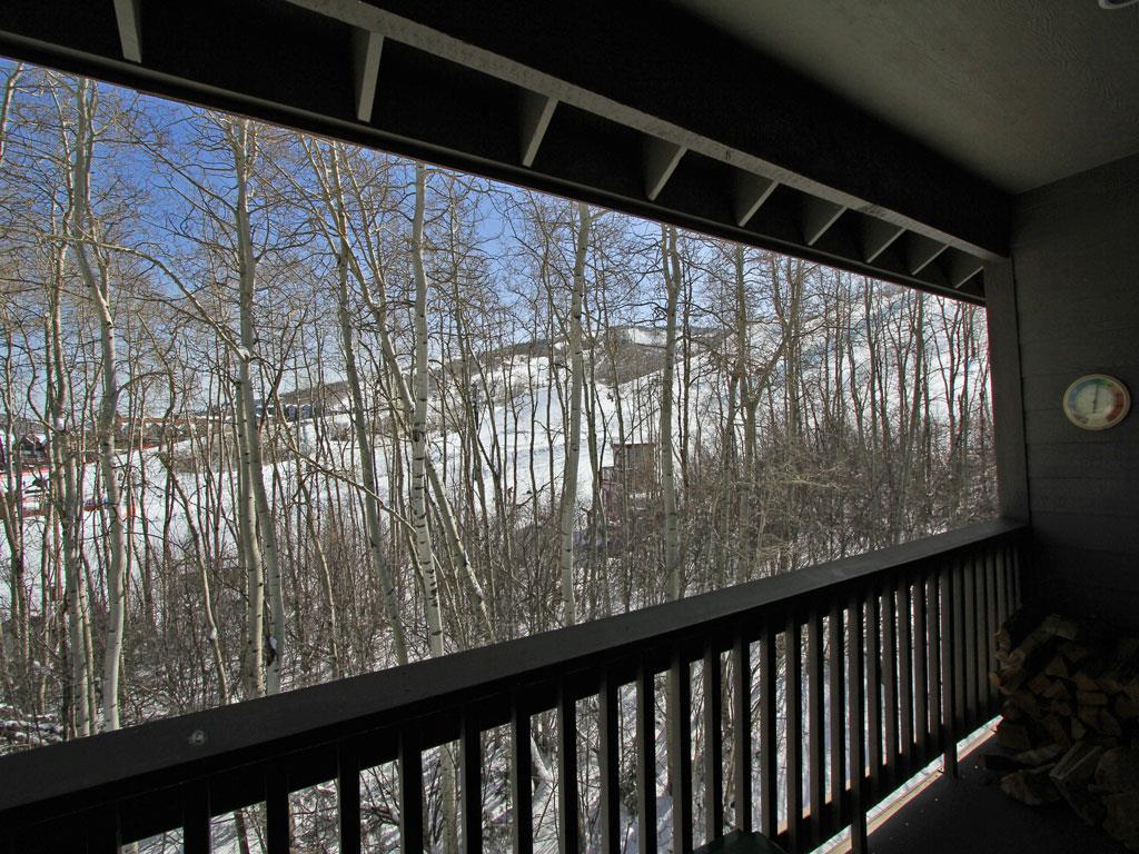 Relax on the deck chairs and take in the aspen grove and resort views.