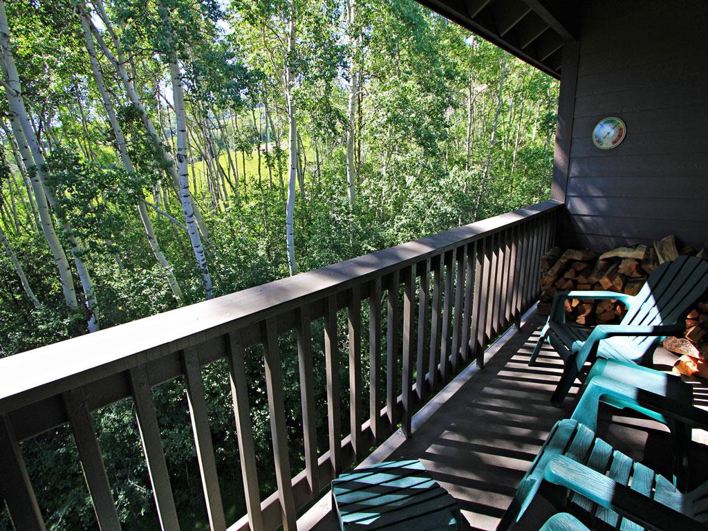 Relax on the deck chairs and take in the aspen grove and resort views.