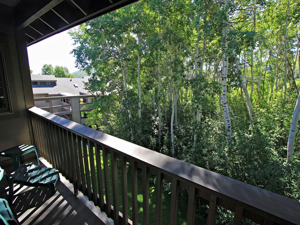 Relax on the deck chairs and take in the aspen grove and resort views.
