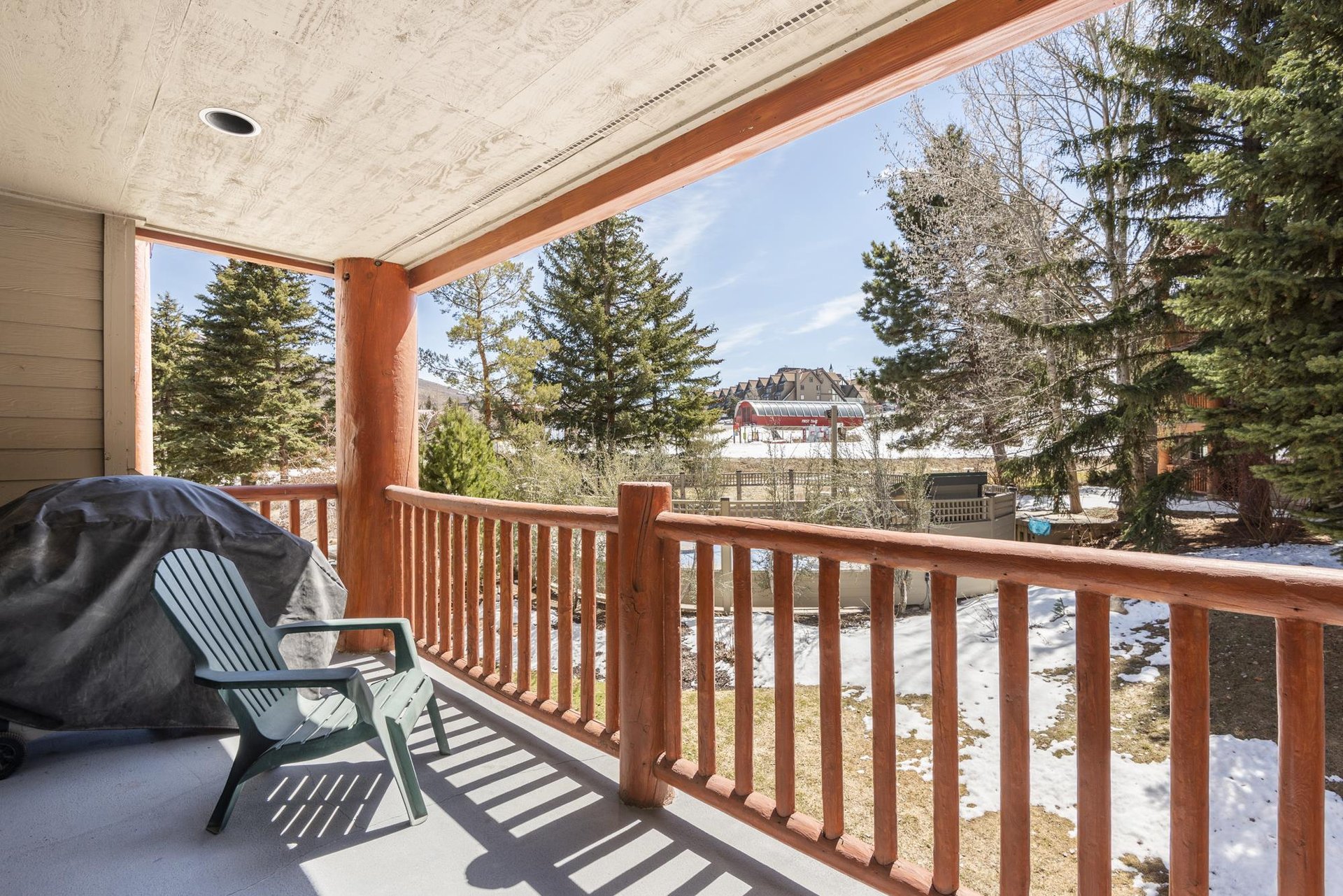 Private patio with views of the First Time Chairlift with a gas grill