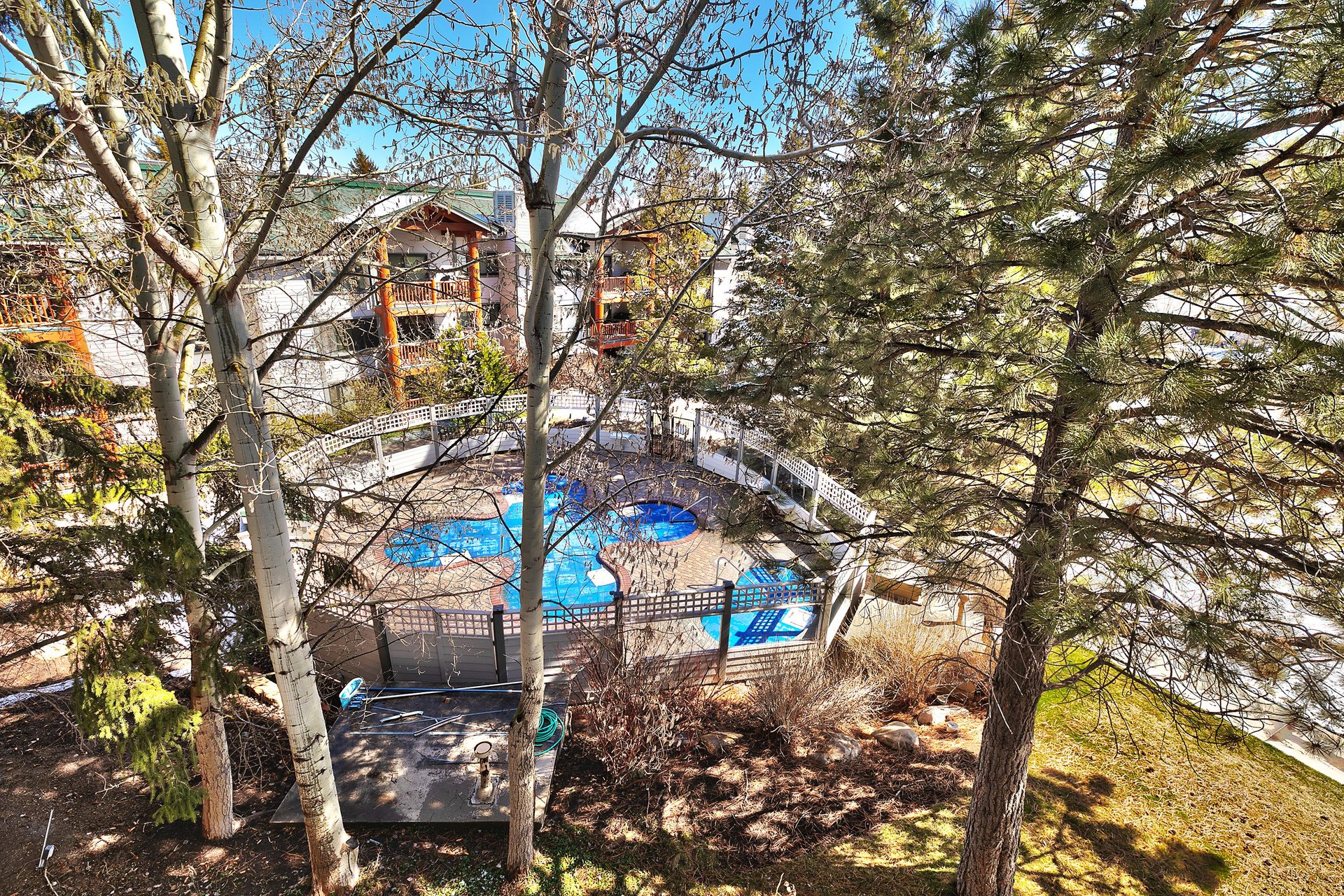 Private patio has views of the clover shaped pool
