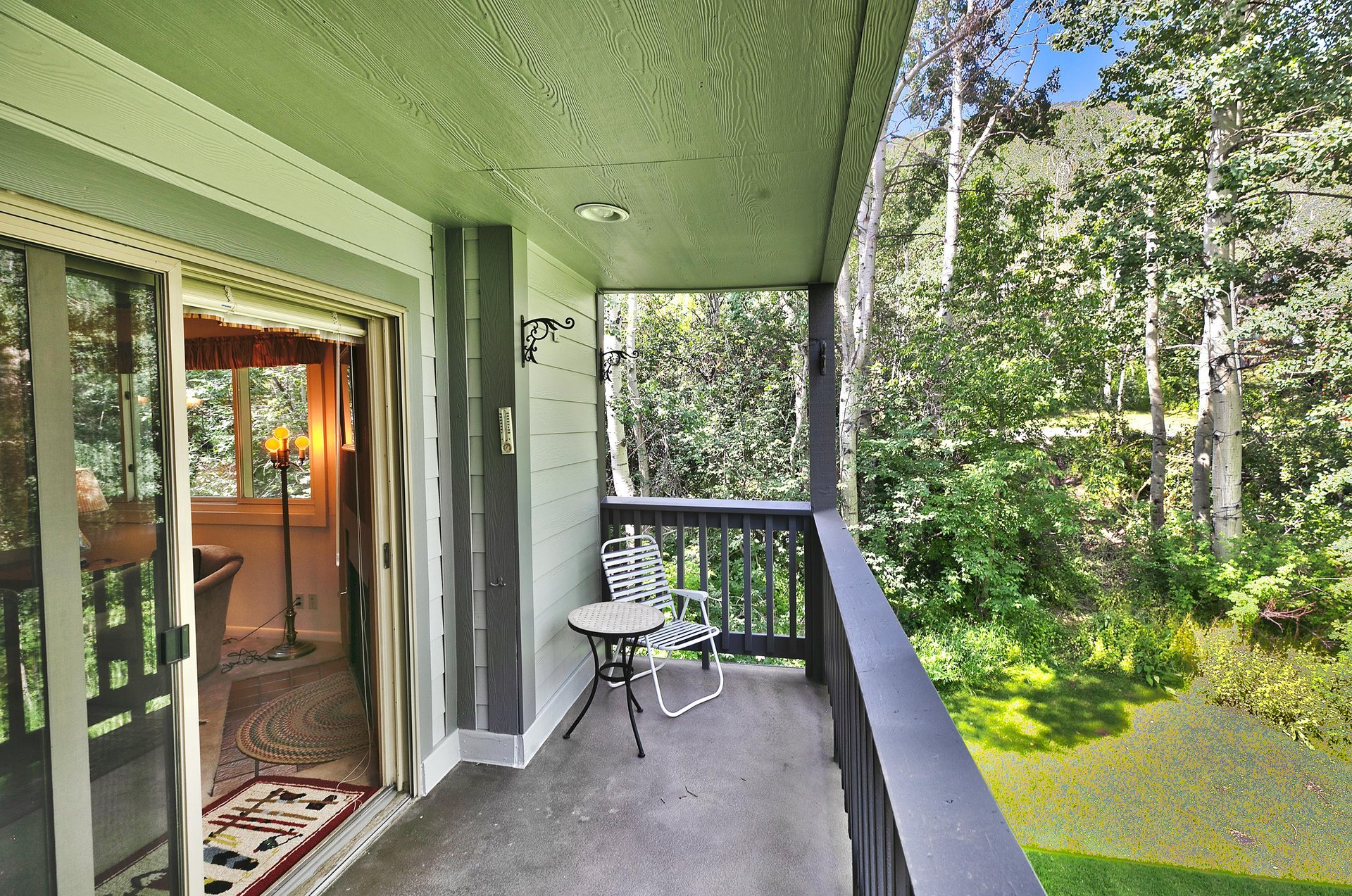 Relax on the private patio overlooking aspen groves