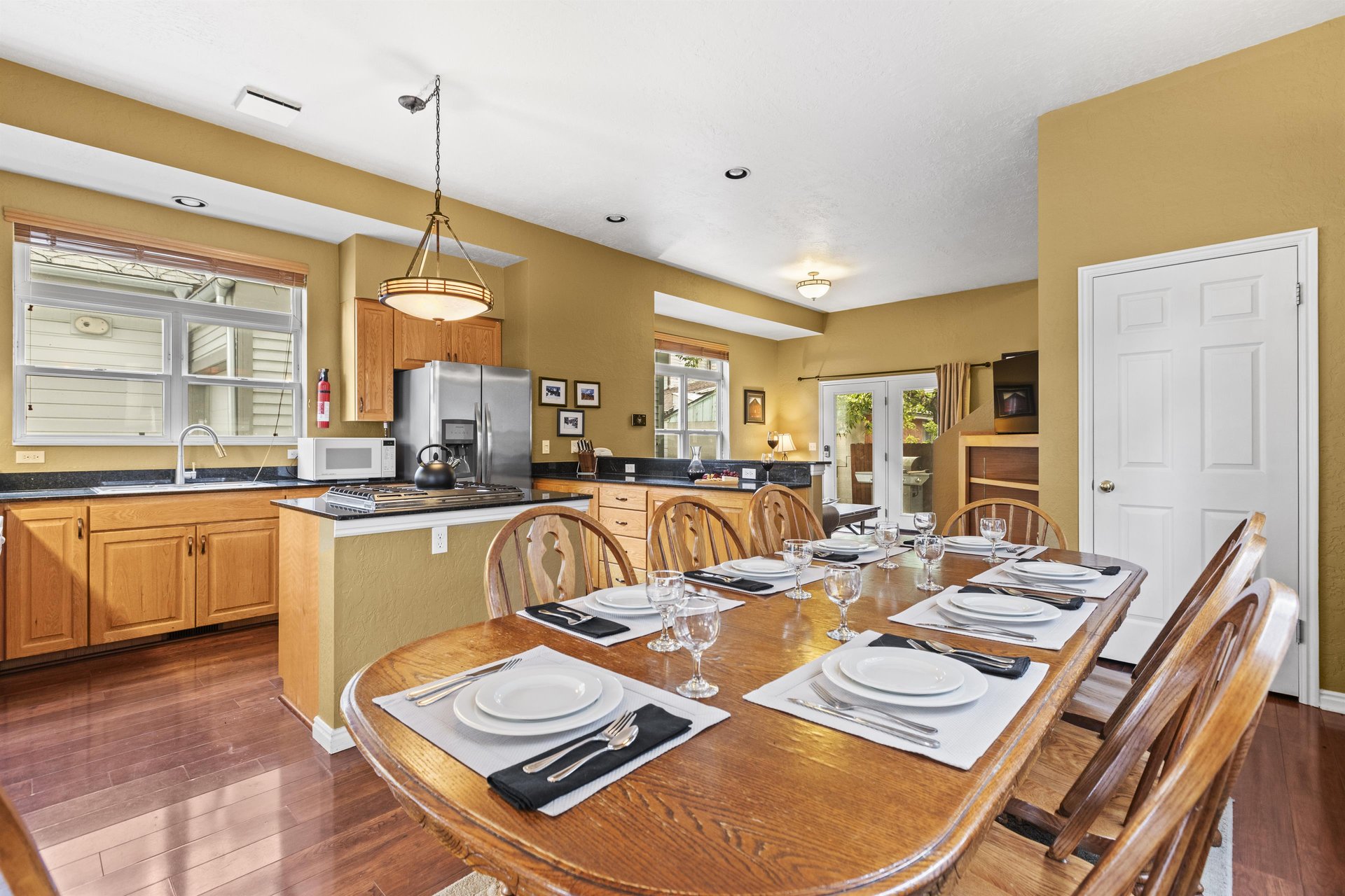 The wooden dining table offers seating for 8.