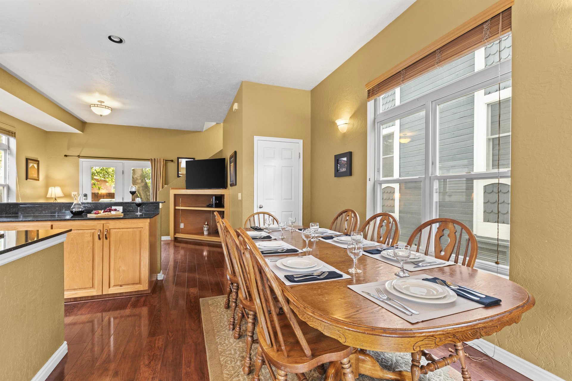 The wooden dining table offers seating for 8.