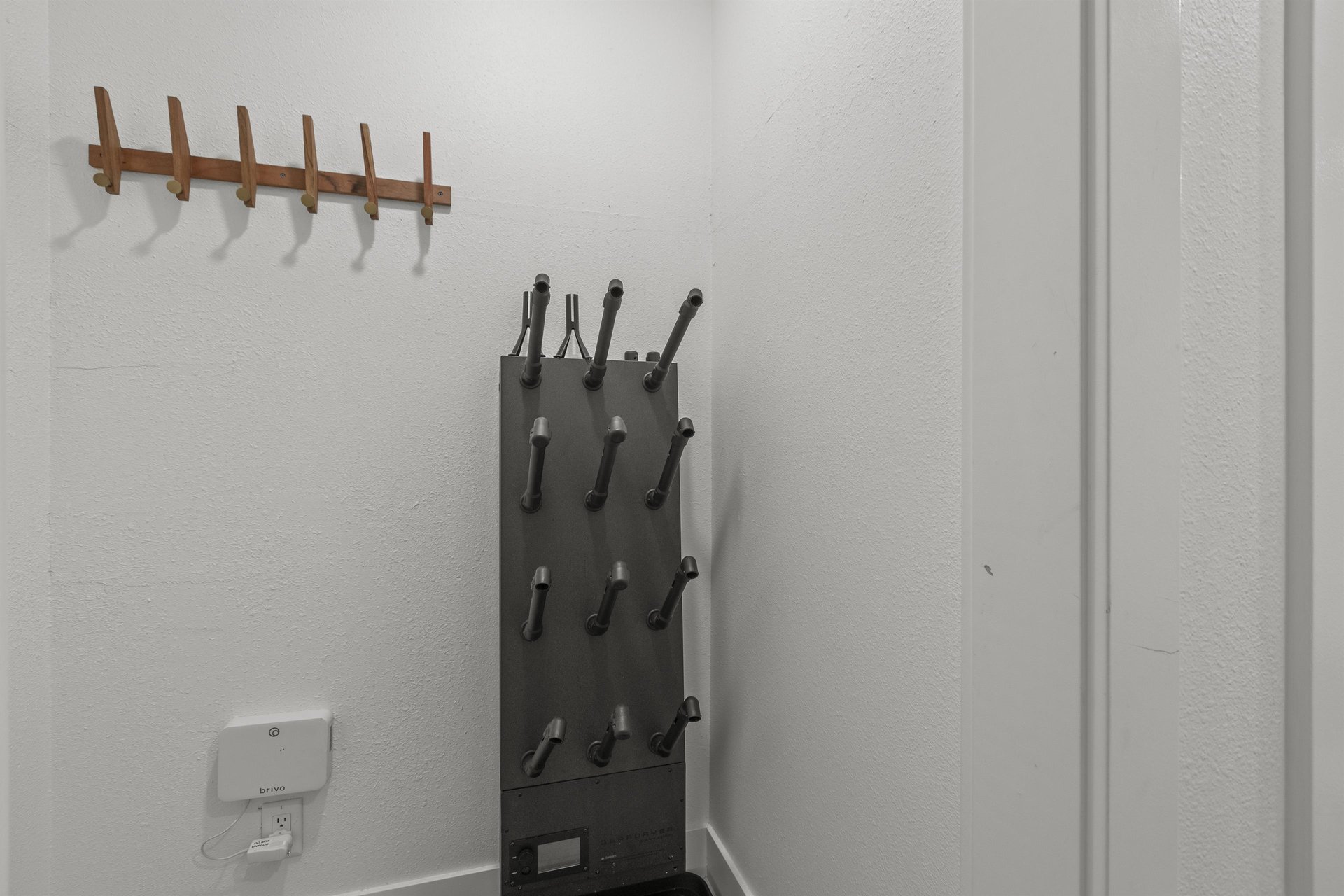 The entryway offers a comfortable bench and place to hang coats.