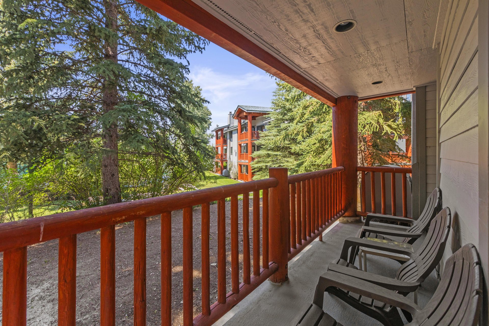 Snow Flower 44 has a private patio and overlooks majestic evergreen trees.