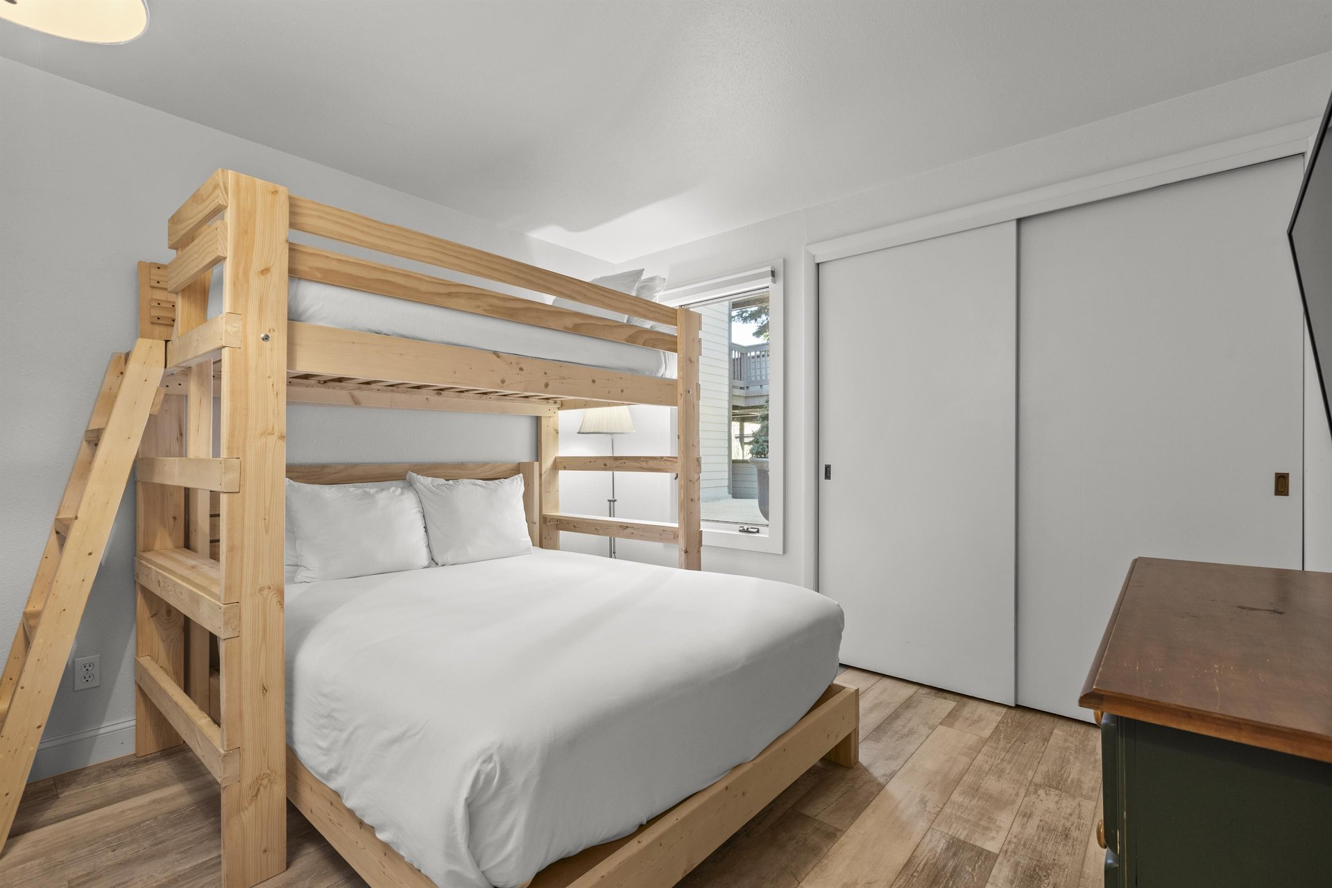 The second bedroom offers a twin over a queen size bunk bed.